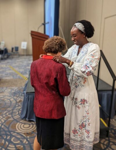 Dr. Amy Paller receiving Gold Medal Award